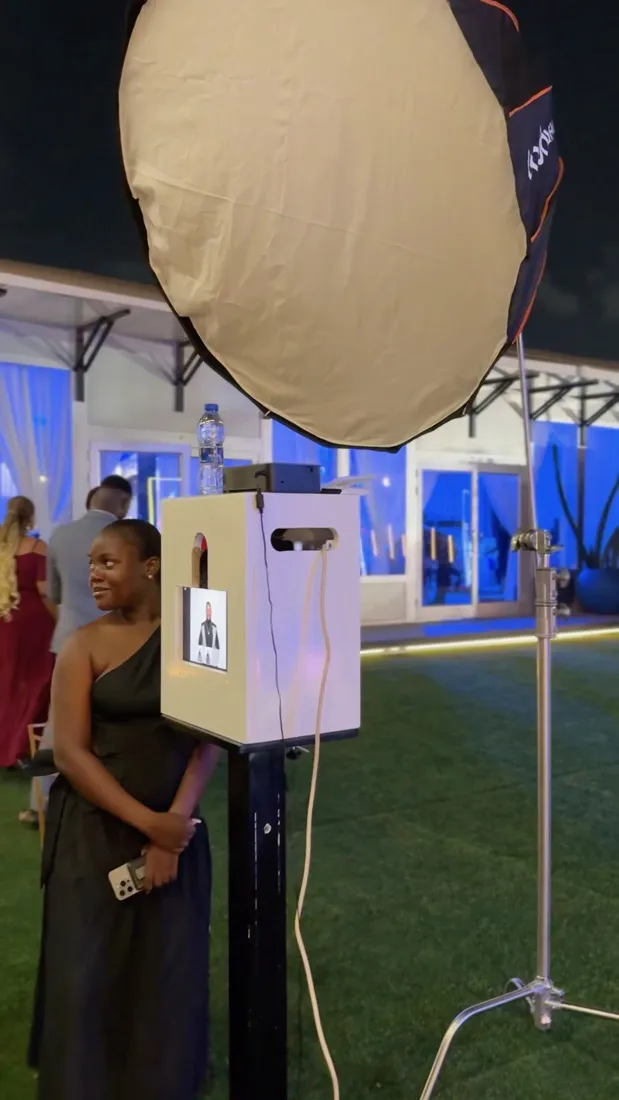 The Glam Photobooth GH booth set up with its softbox light at an evening event in Accra